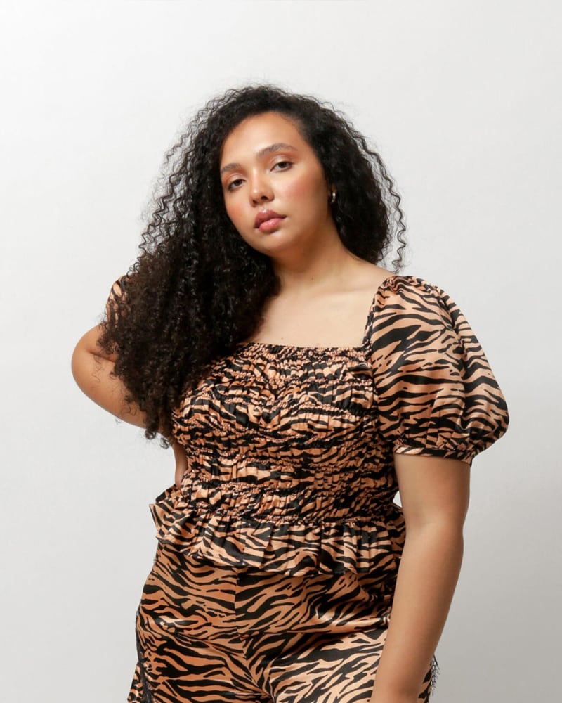Front of a model wearing a size L Bella B Satin Shorts in Tiger Print by LuvMeMore. | dia_product_style_image_id:266615